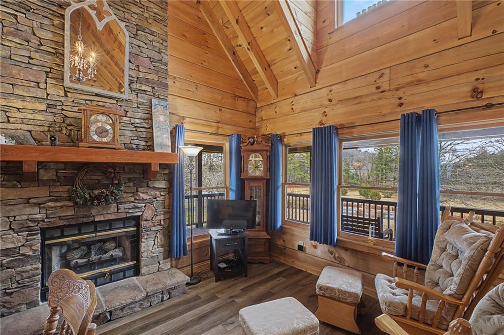 335 Bells Ferry Road Northeast Rome, GA 30161 - Photo 17 of 81 a living room with furniture a flat screen tv and a fireplace