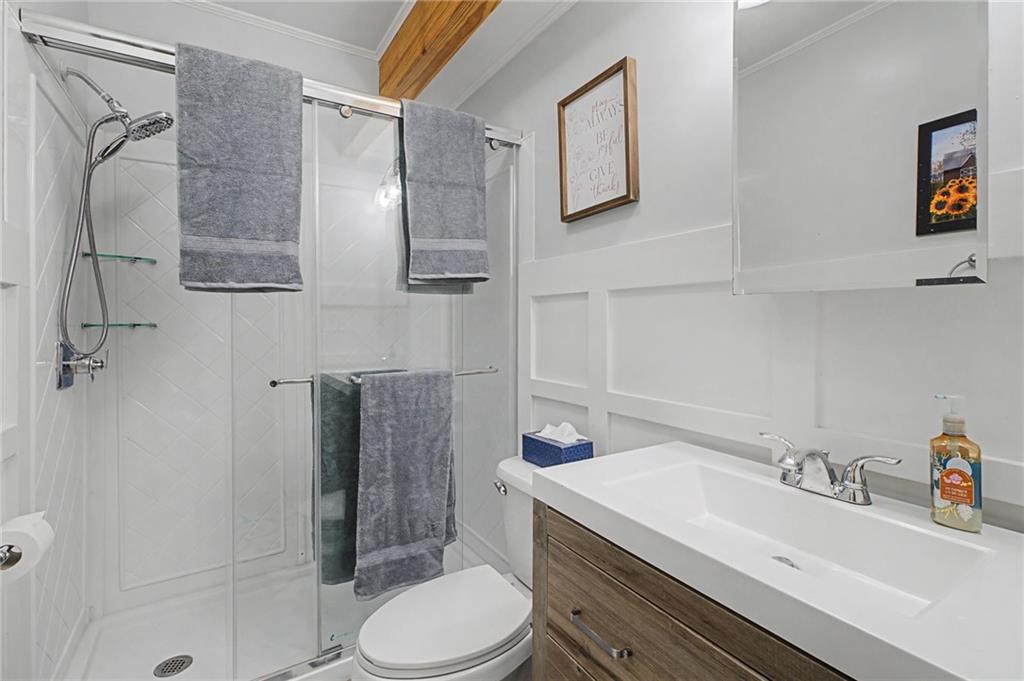 335 Bells Ferry Road Northeast Rome, GA 30161 - Photo 25 of 81 a bathroom with a sink toilet and shower