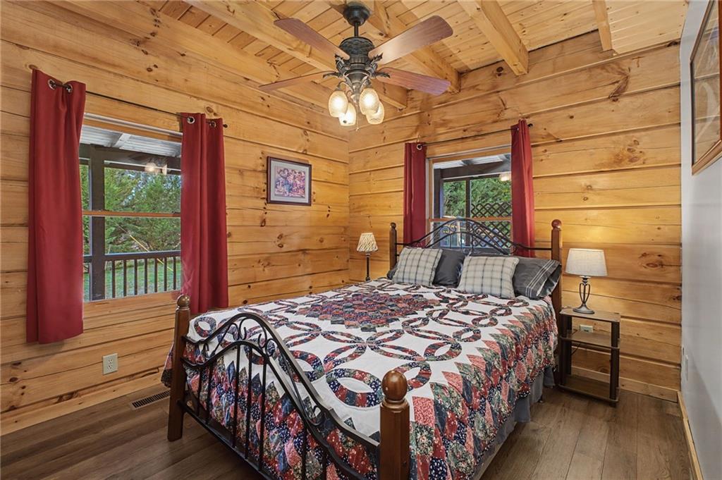 335 Bells Ferry Road Northeast Rome, GA 30161 - Photo 26 of 81 a bed sitting in a bedroom next to a window