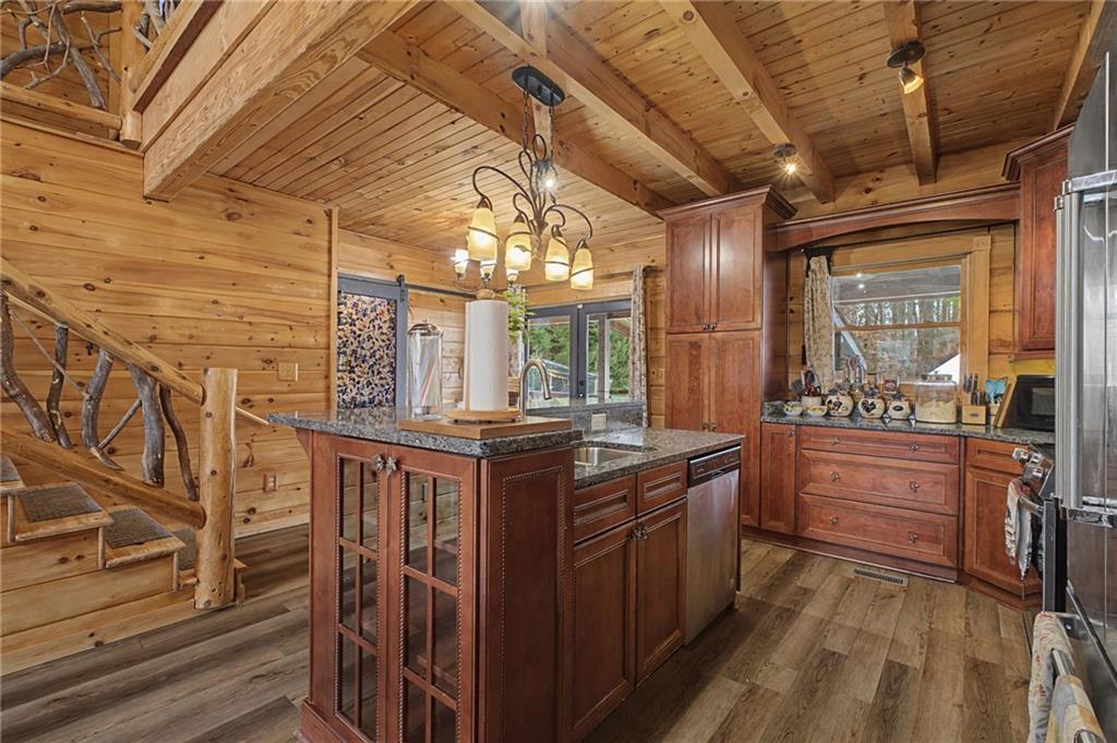 335 Bells Ferry Road Northeast Rome, GA 30161 - Photo 30 of 81 a kitchen with stainless steel appliances granite countertop a stove and cabinets