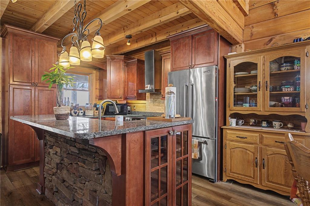 335 Bells Ferry Road Northeast Rome, GA 30161 - Photo 34 of 81 a kitchen with stainless steel appliances granite countertop a sink a stove and refrigerator