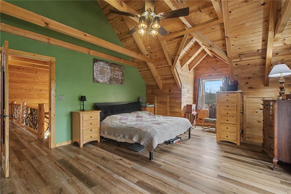 335 Bells Ferry Road Northeast Rome, GA 30161 - Photo 49 of 81 a bedroom with a bed and a chandelier