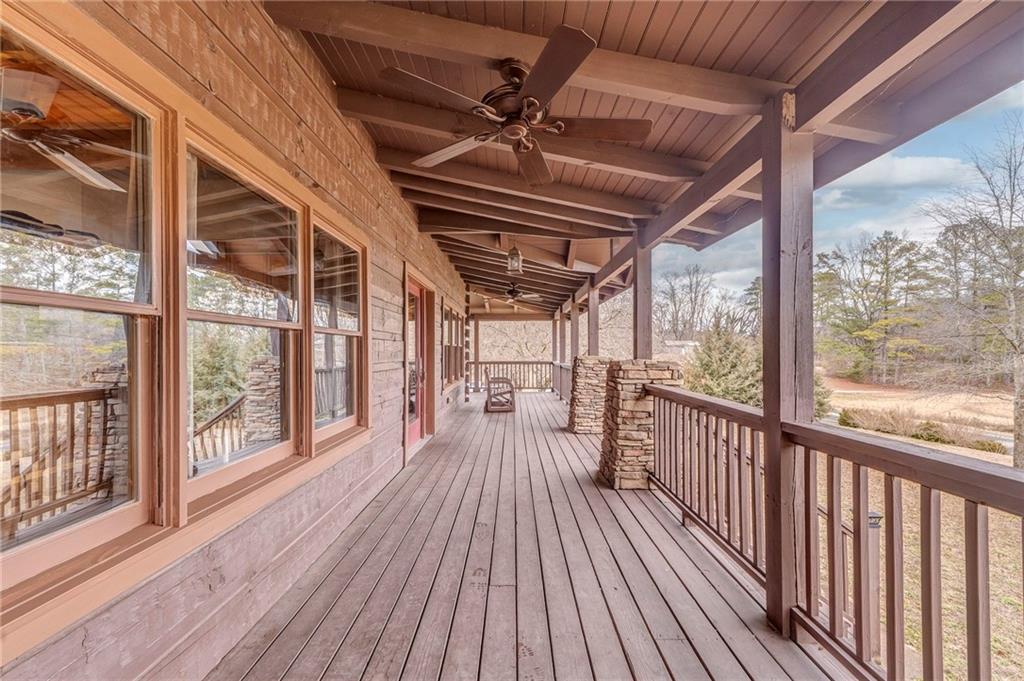 335 Bells Ferry Road Northeast Rome, GA 30161 - Photo 6 of 81 a view of a balcony with wooden floor