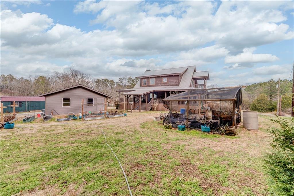 335 Bells Ferry Road Northeast Rome, GA 30161 - Photo 64 of 81 a view of a big house with wooden fence