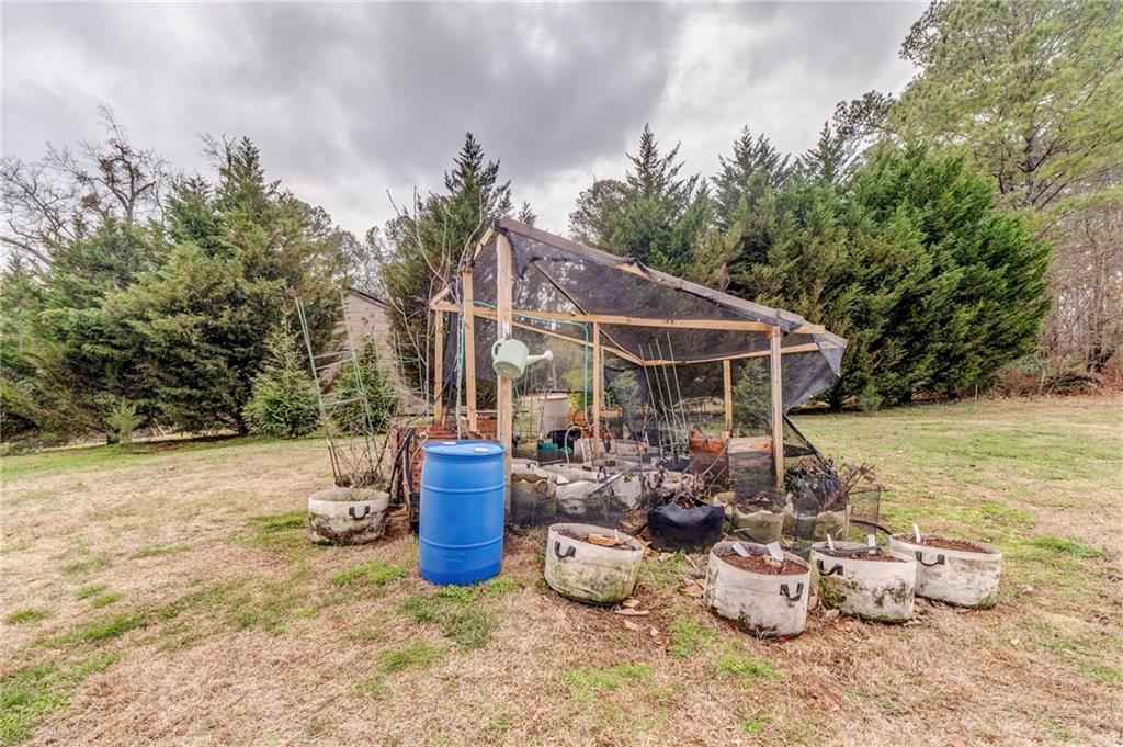 335 Bells Ferry Road Northeast Rome, GA 30161 - Photo 67 of 81 a view of a chair and tables in the patio yard