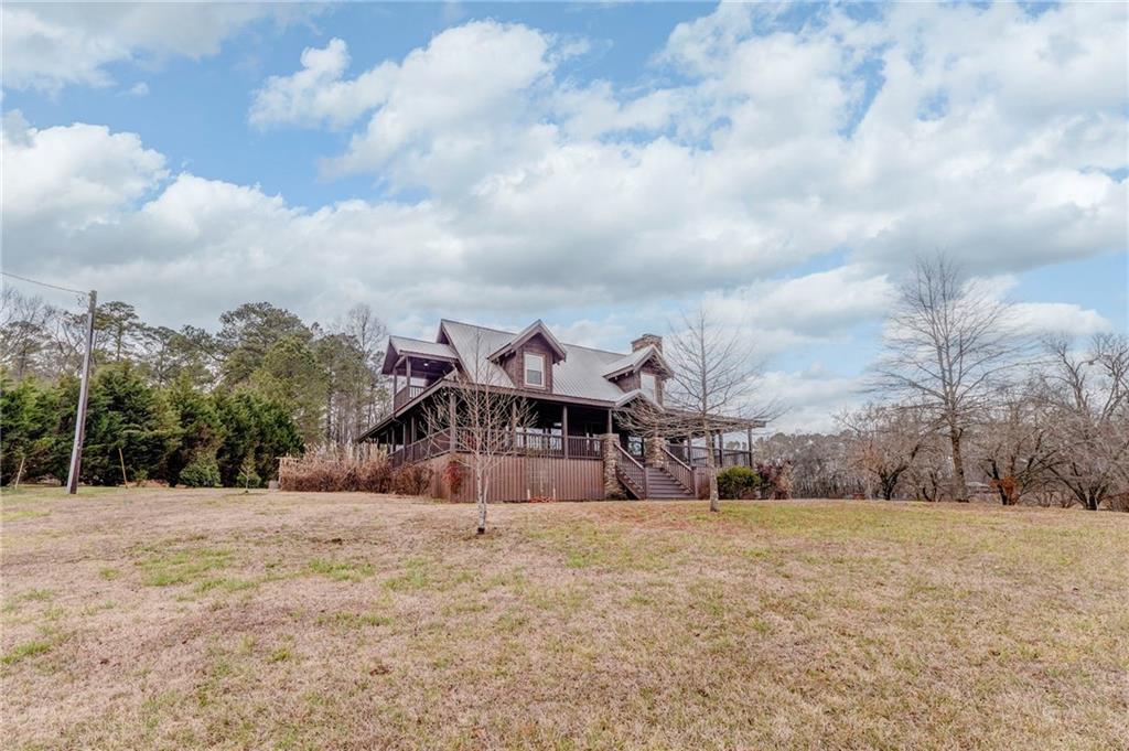 335 Bells Ferry Road Northeast Rome, GA 30161 - Photo 78 of 81 a view of large house with a big yard and large trees