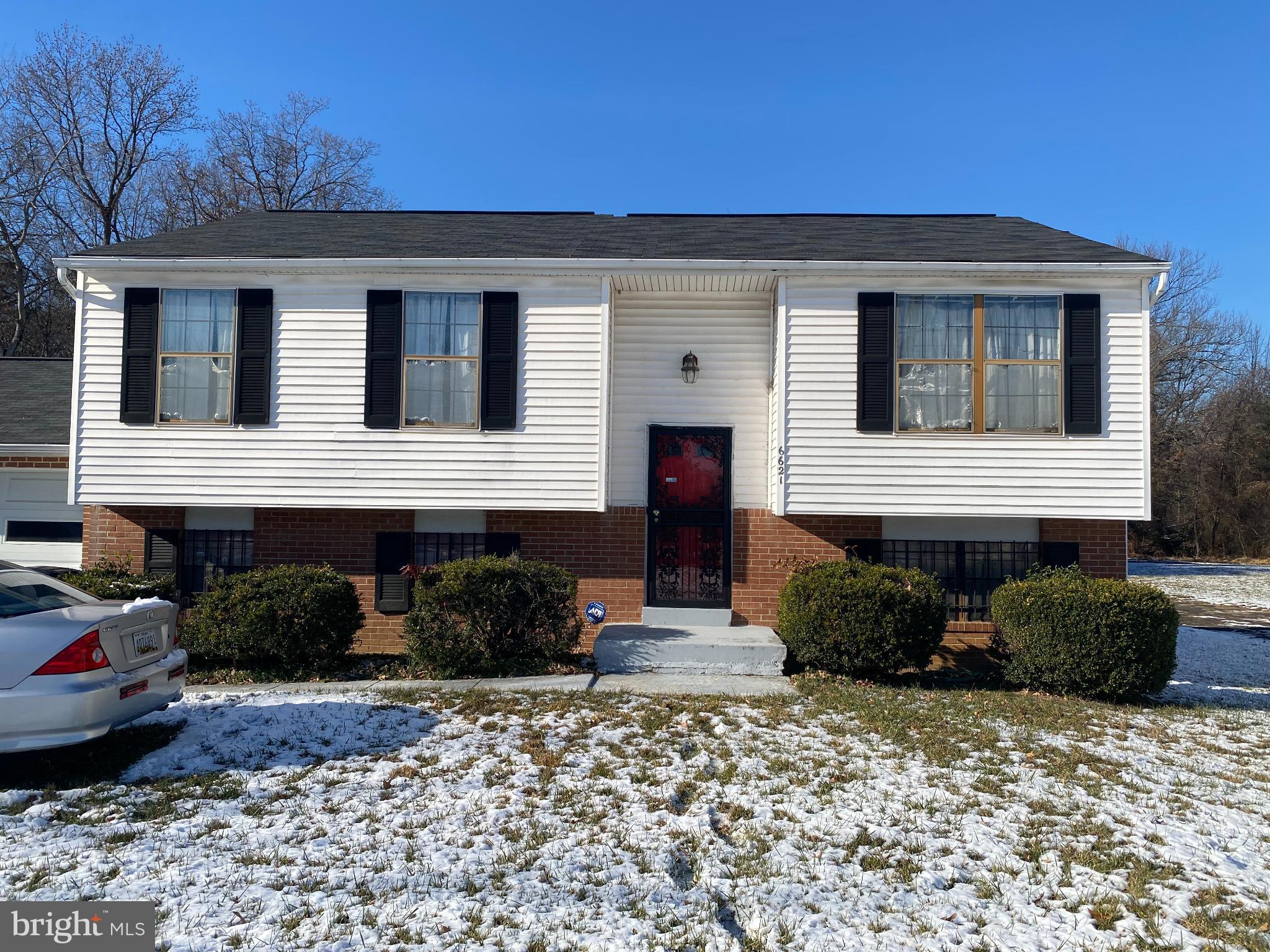 Charming split-level home in winter's embrace.