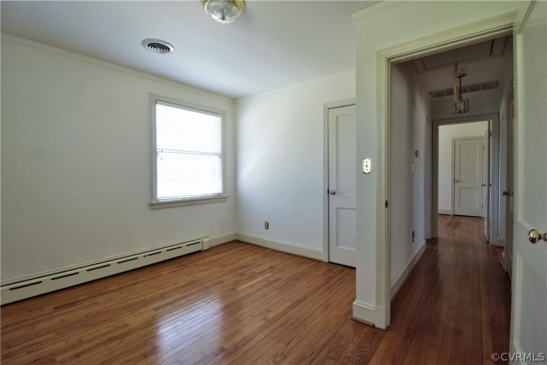 2931 Osborne Road Chester, VA 23831 - Photo 20 of 24 a view of an empty room with wooden floor and a window