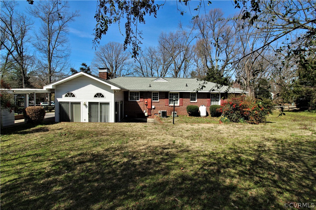 2931 Osborne Road Chester, VA 23831 - Photo 23 of 24 a front view of a house with a yard