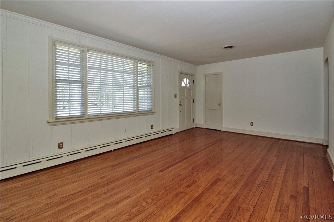 2931 Osborne Road Chester, VA 23831 - Photo 6 of 24 an empty room with wooden floor and windows