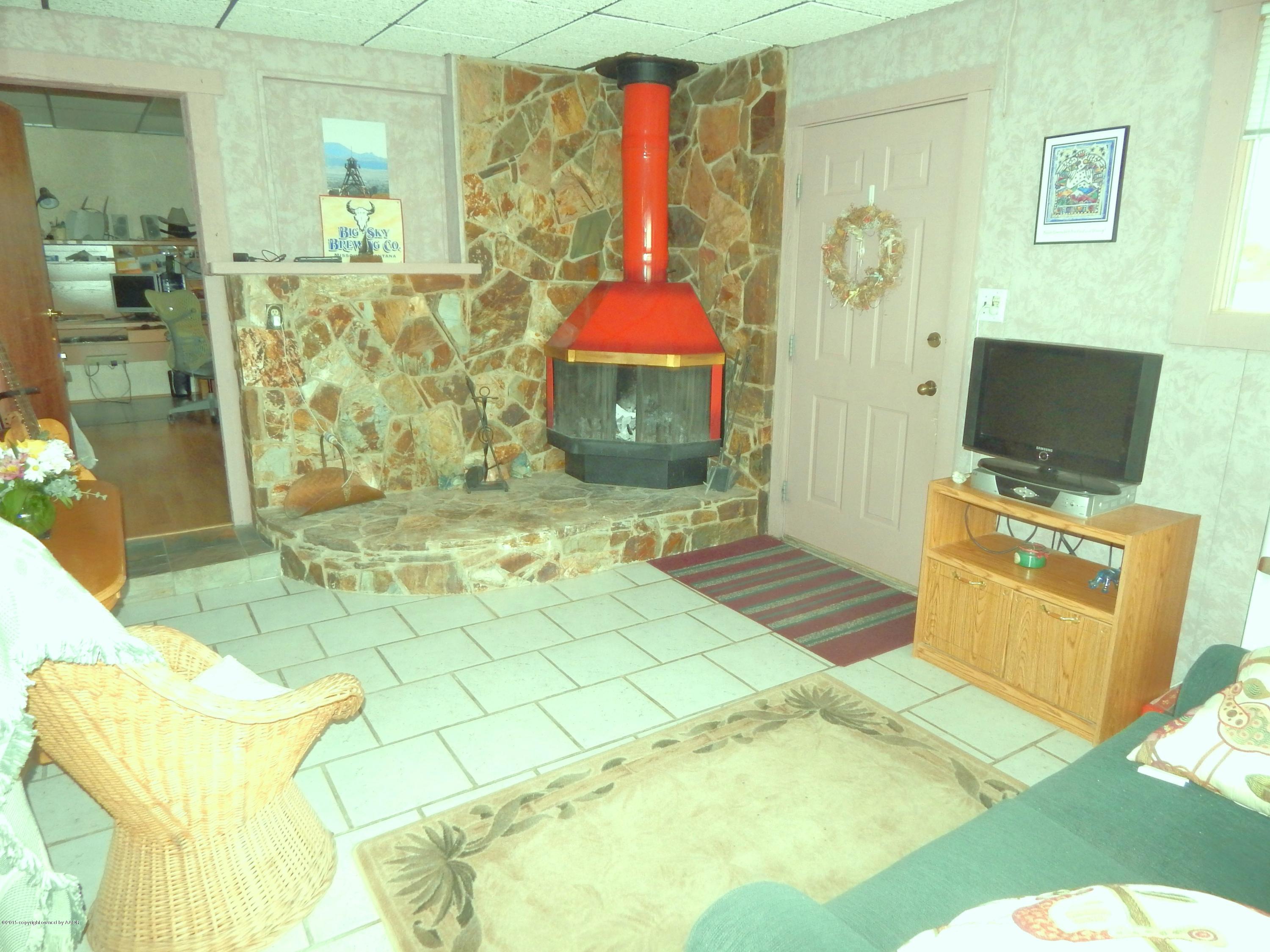 6100 Hester Road Amarillo, TX 79124 - Photo 12 of 21 DEN W/ WOOD BURNING FIREPLACE