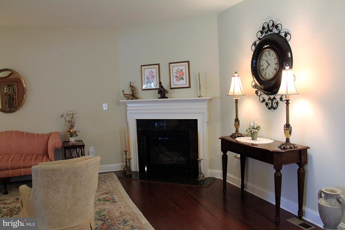 636 Lititz Reserve Lane, Unit 84 Lititz, PA 17543 - Photo 14 of 44 Great Room Hardwood Floor and Gas Fireplace