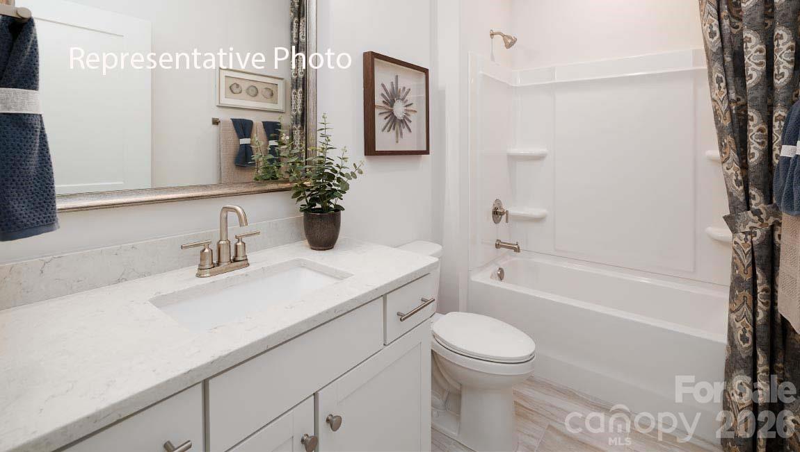3221 Oberon Street York, SC 29745 - Photo 20 of 23 a bathroom with a sink a toilet and shower