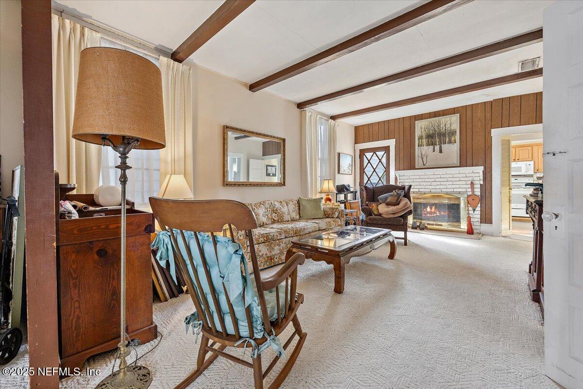 517 Beach Avenue Atlantic Beach, FL 32233 - Photo 11 of 25 a living room with furniture and a table