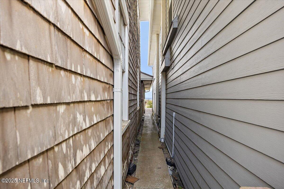 517 Beach Avenue Atlantic Beach, FL 32233 - Photo 25 of 25 a view of balcony with wooden floor and stairs
