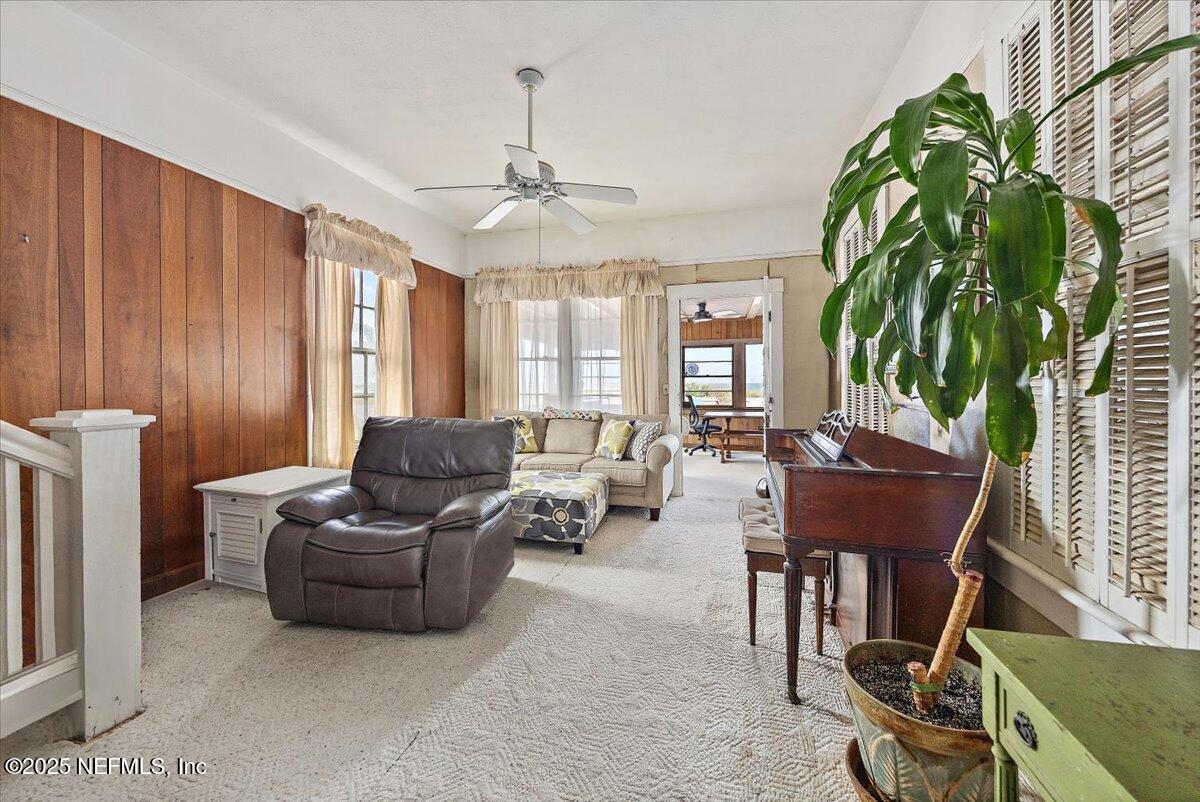 517 Beach Avenue Atlantic Beach, FL 32233 - Photo 7 of 25 a living room with furniture a ceiling fan and a rug