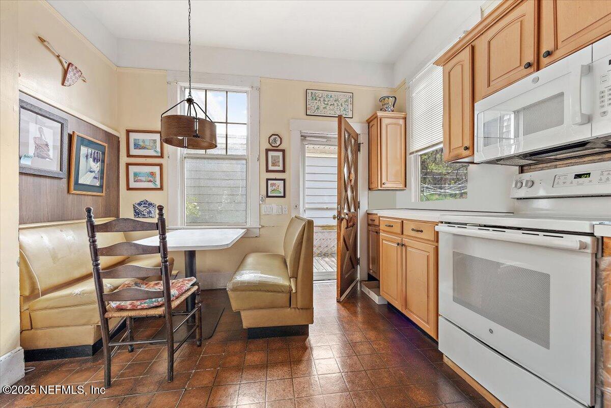 517 Beach Avenue Atlantic Beach, FL 32233 - Photo 9 of 25 a living room with furniture a fireplace and wooden floor