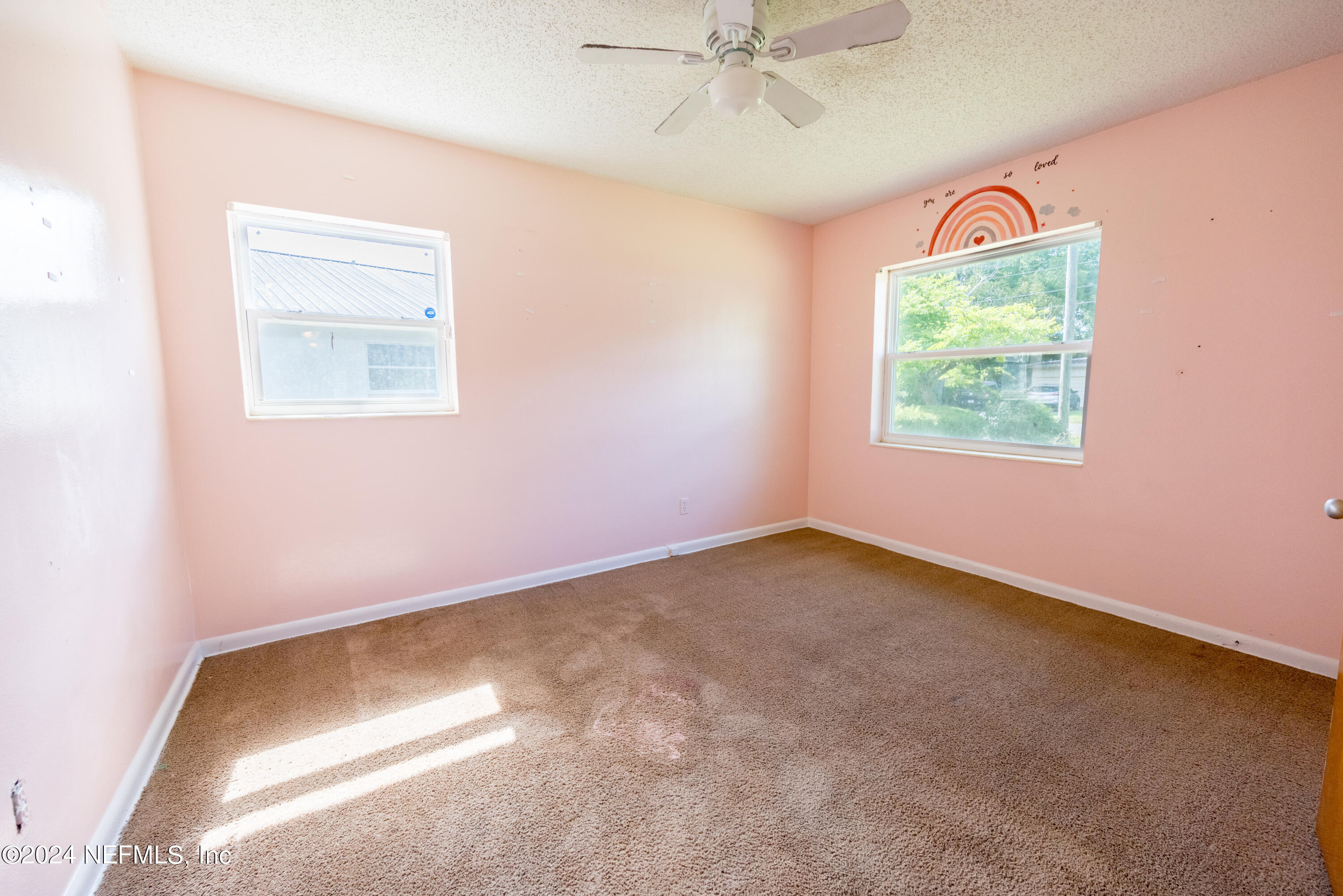 1122 West Pratt Street Starke, FL 32091 - Photo 16 of 22 an empty room with a fan and a window