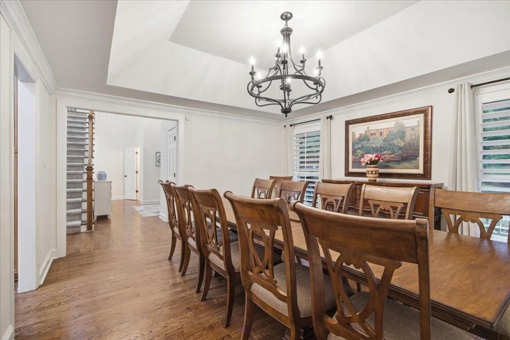 397 Thomas Road Dallas, GA 30132 - Photo 14 of 108 a view of a dining room with furniture wooden floor and chandelier