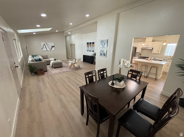 11313 South 265 East Sandy, UT 84070 - Photo 1 of 21 Open-concept living area featuring light wood-finish flooring throughout