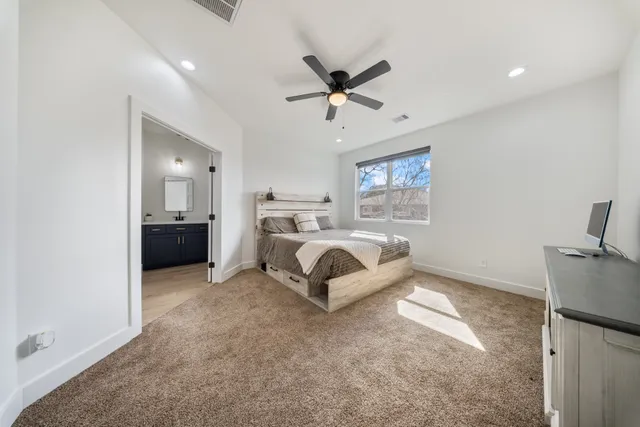 a bathroom with a sink a shower and a mirror