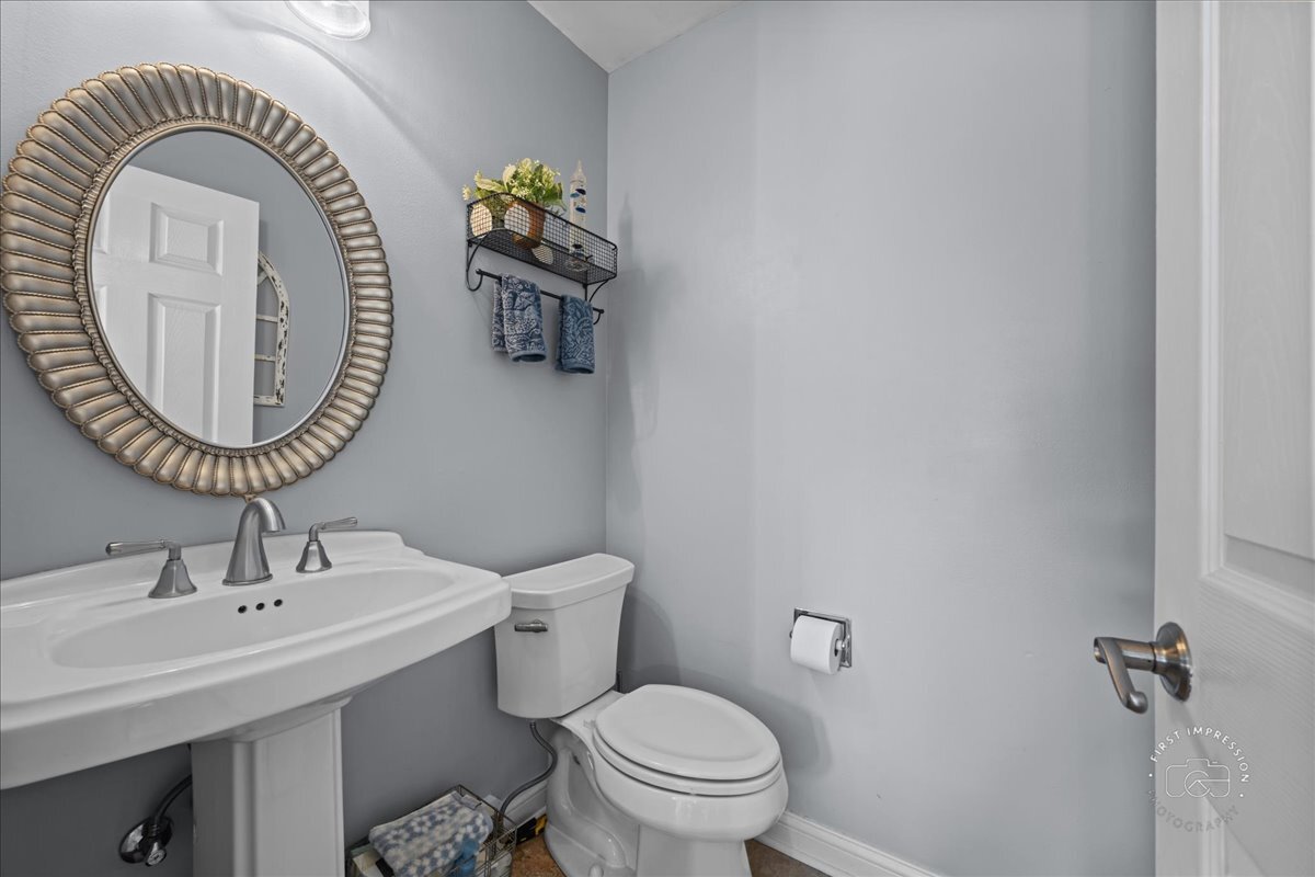 2138 Derby Court Wheaton, IL 60189 - Photo 13 of 24 a bathroom with a sink and a mirror