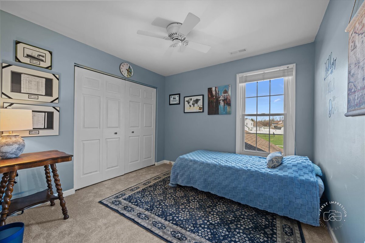 2138 Derby Court Wheaton, IL 60189 - Photo 16 of 24 a bedroom with a bed dresser and a window