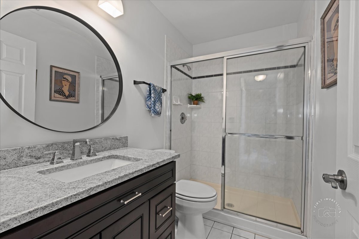 2138 Derby Court Wheaton, IL 60189 - Photo 18 of 24 a bathroom with a granite countertop sink toilet and shower
