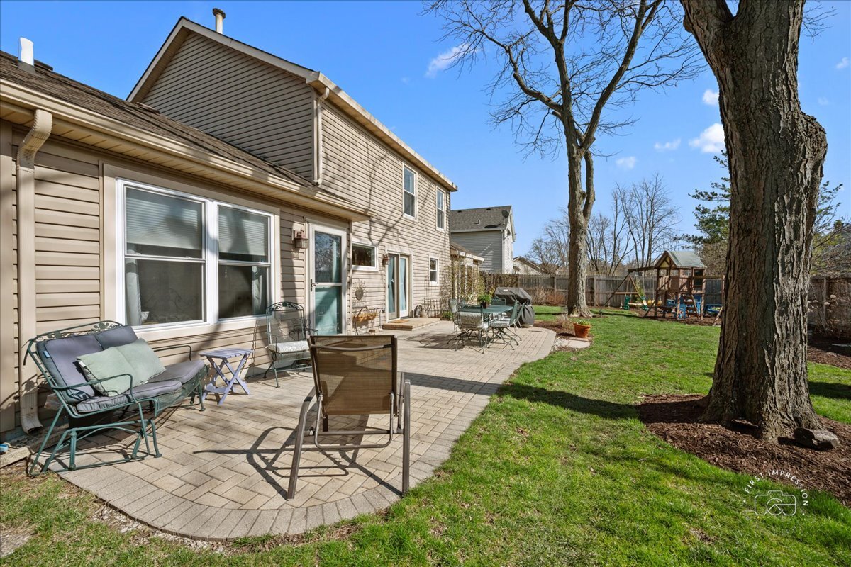 2138 Derby Court Wheaton, IL 60189 - Photo 21 of 24 a view of a house with backyard porch and sitting area