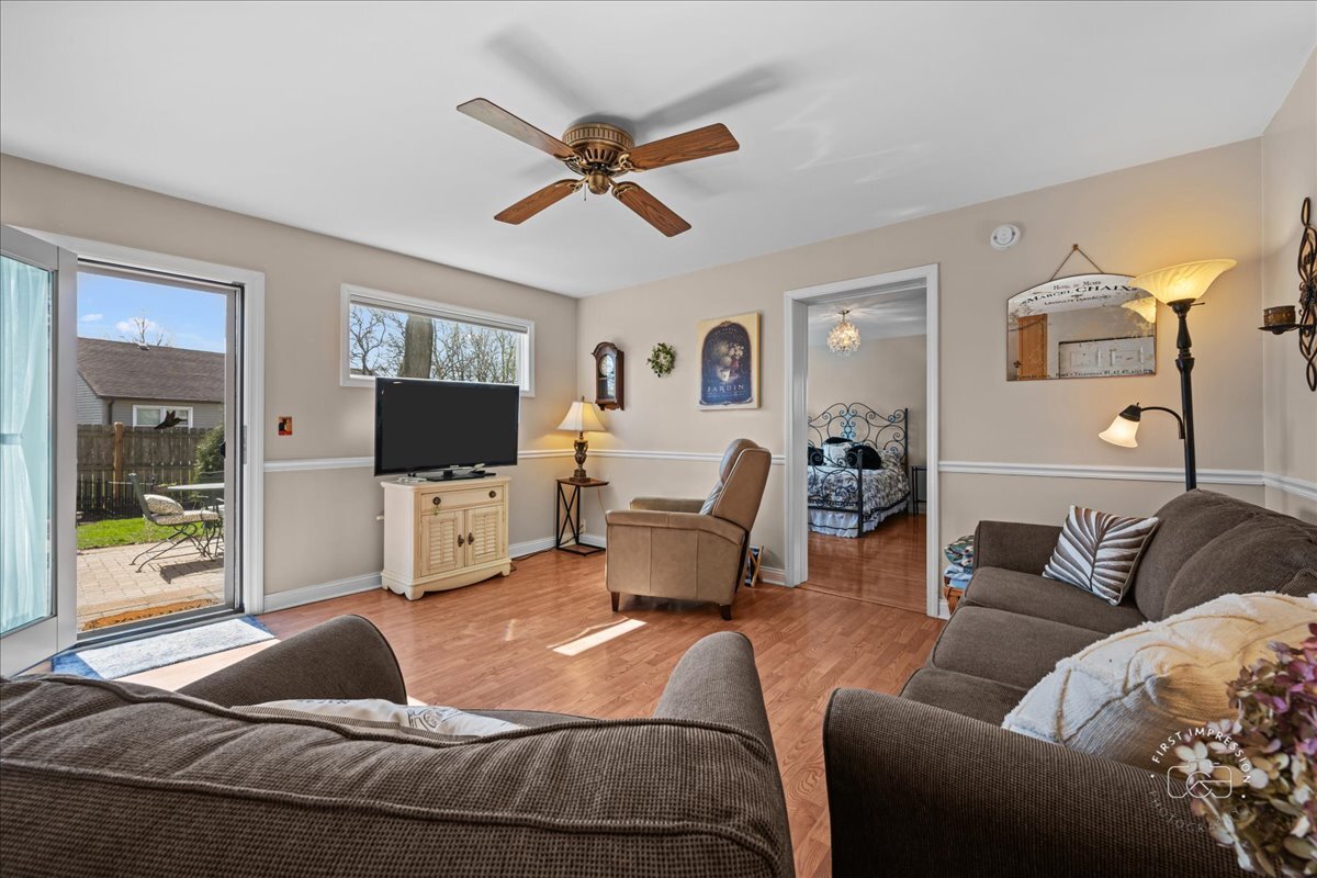 2138 Derby Court Wheaton, IL 60189 - Photo 8 of 24 a living room with furniture and a flat screen tv