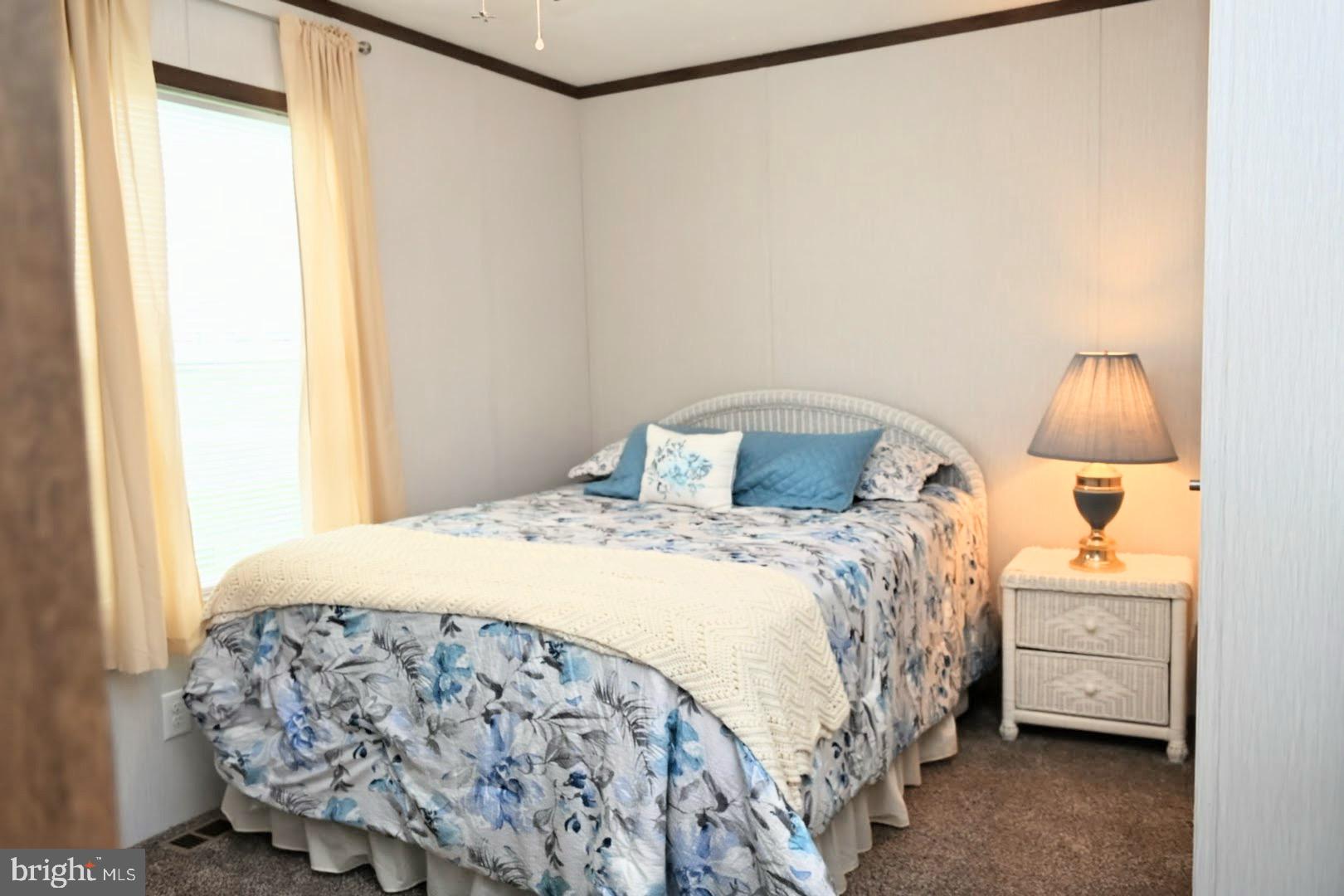 103 Carbridge Road East Stewartstown, PA 17363 - Photo 20 of 28 a bedroom with a bed and a night stand