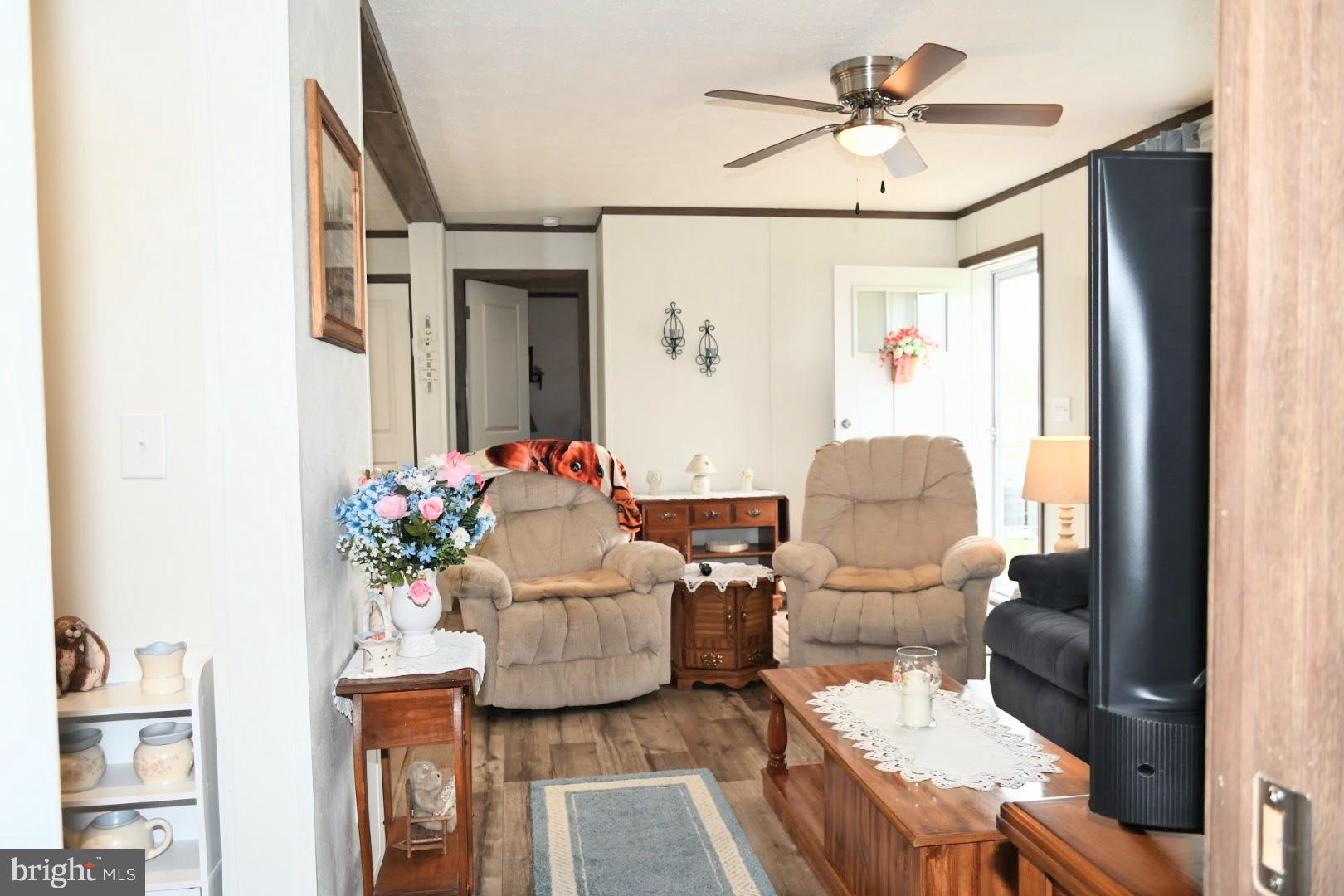 103 Carbridge Road East Stewartstown, PA 17363 - Photo 4 of 28 a living room with furniture and flowers