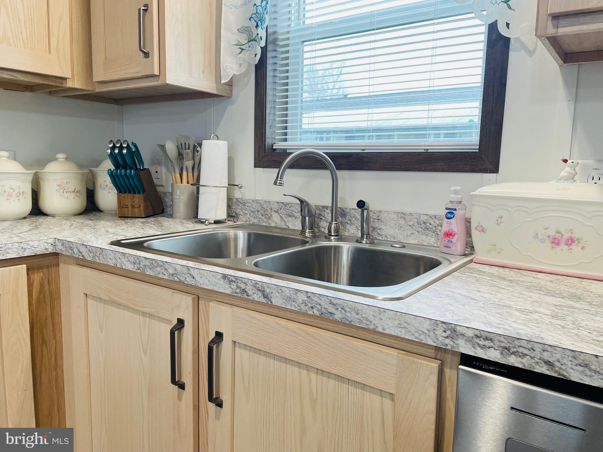 103 Carbridge Road East Stewartstown, PA 17363 - Photo 10 of 28 a kitchen with stainless steel appliances granite countertop a sink dishwasher and cabinets with wooden floor