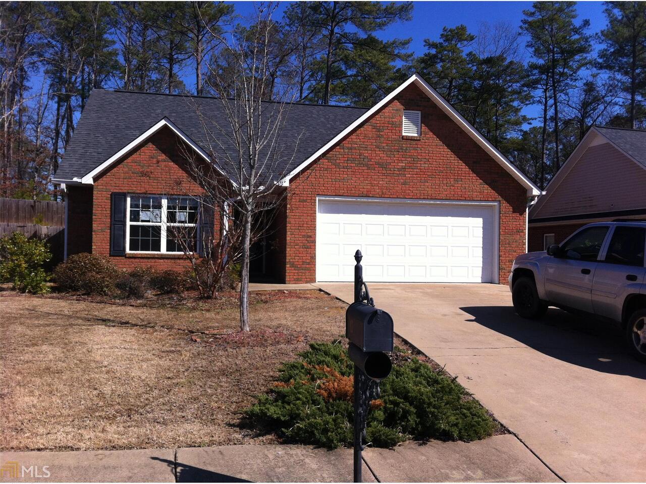 10 Hawk Spring SW Drive Rome, GA 30165 - Photo 1 of 1 a front view of a house with a yard and garage