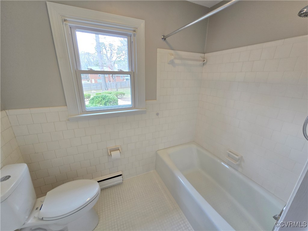 4600 Bruce Road Chester, VA 23831 - Photo 41 of 44 a white toilet sitting next to a bath tub