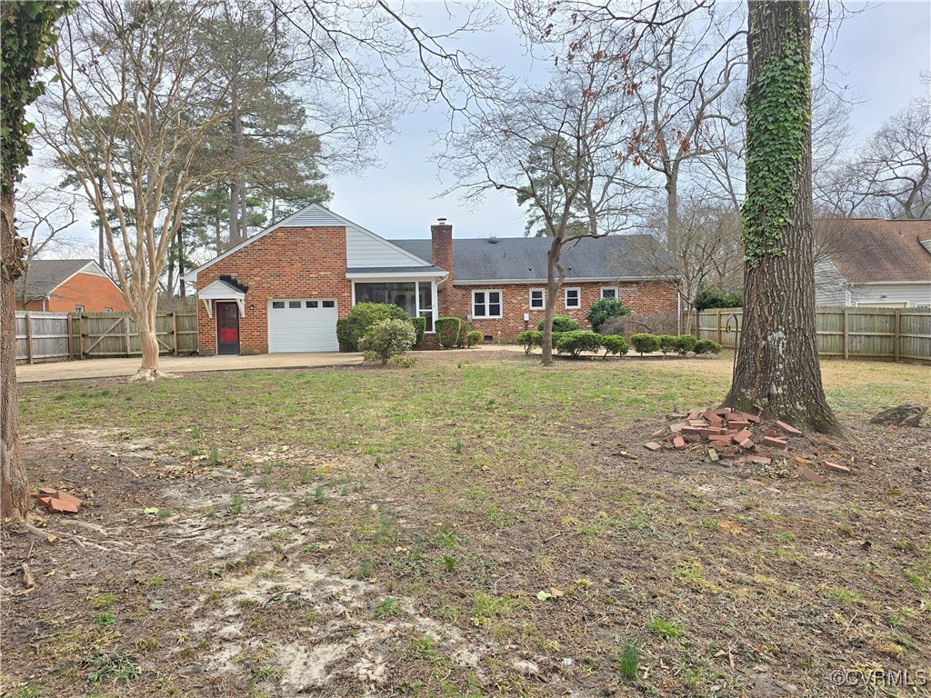 4600 Bruce Road Chester, VA 23831 - Photo 5 of 44 a front view of a house with a yard and garage