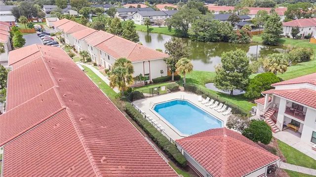 an aerial view of a house with a lake view