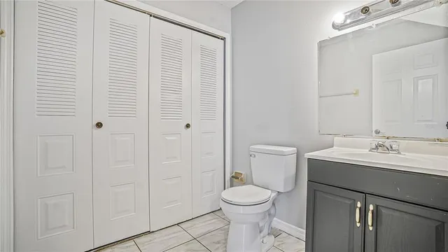 a bathroom with a toilet a sink and shower