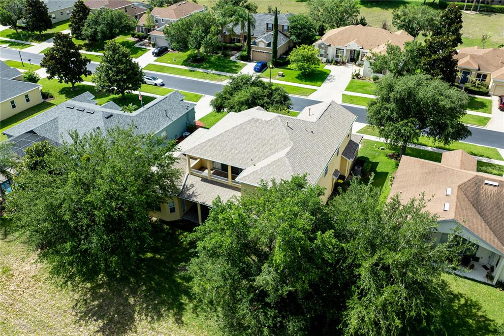 2718 Knightsbridge Road Clermont, FL 34711 - Photo 66 of 72 an aerial view of a house with garden space and street view
