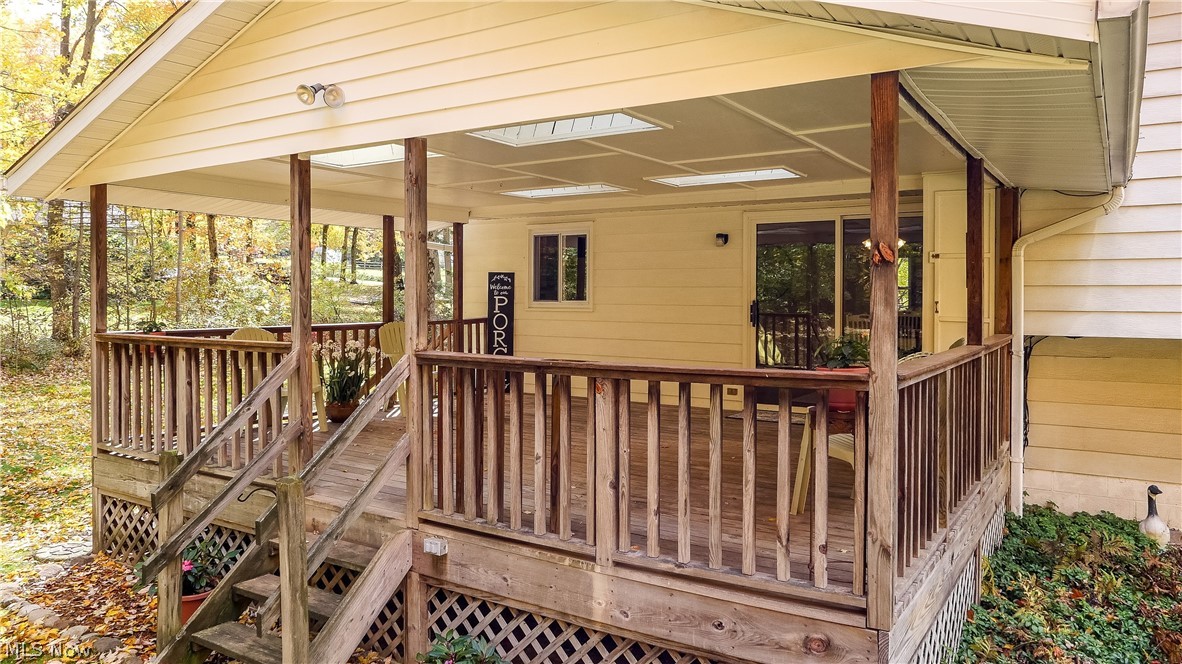 12464 Alpha Road Hiram, OH 44234 - Photo 26 of 33 Covered deck with gates and sliding glass door entry from the eat-in kitchen