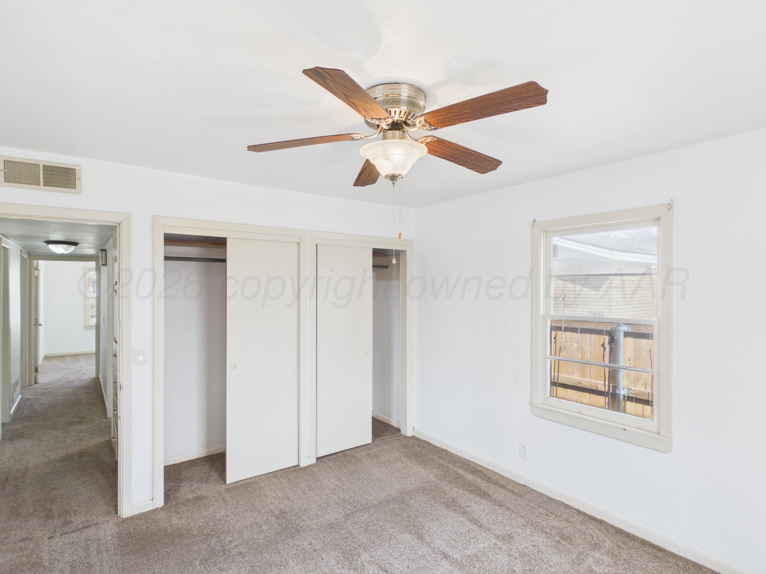 813 Northeast 3rd Street Dumas, TX 79029 - Photo 12 of 22 a view of an empty room