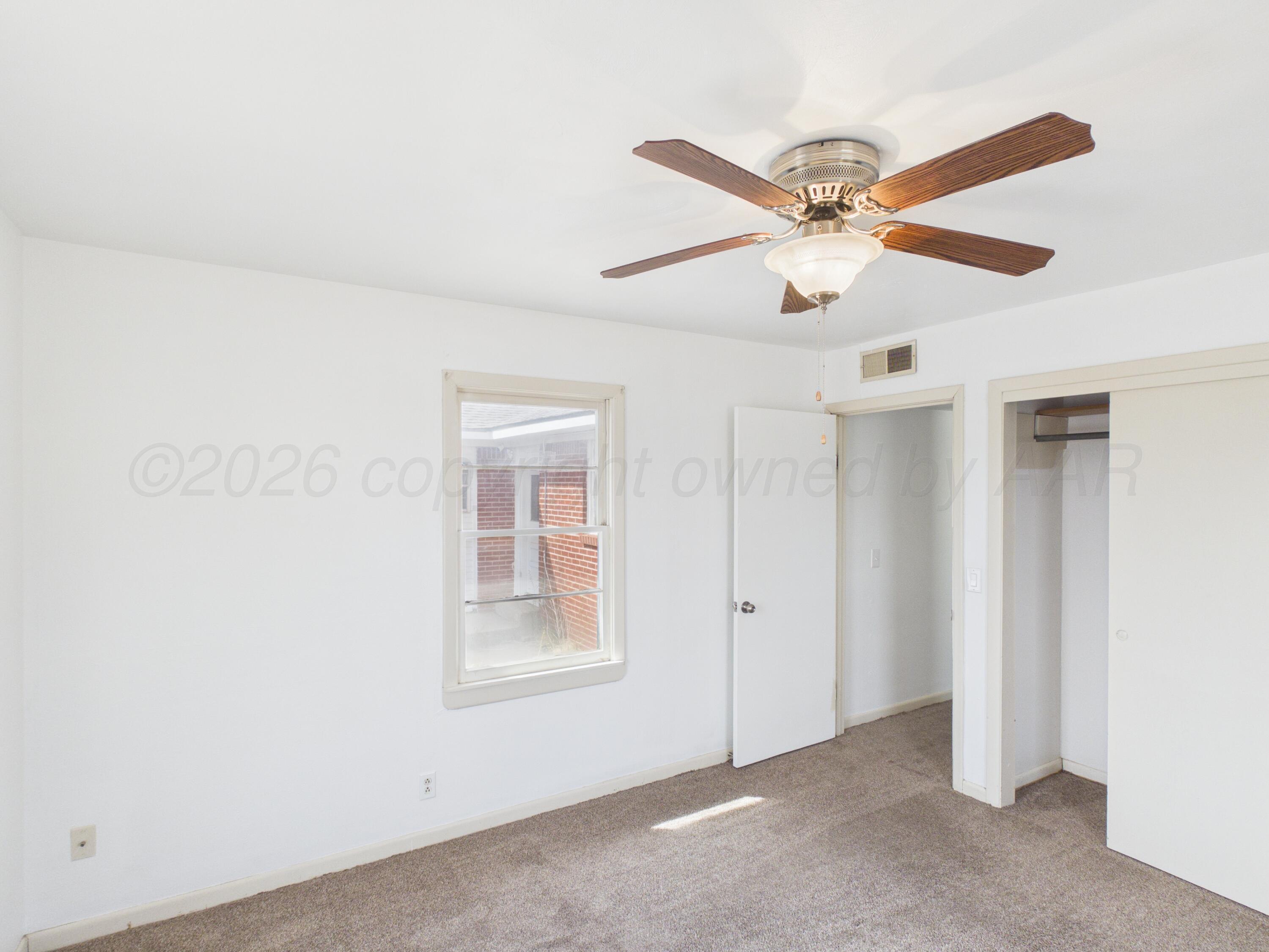 813 Northeast 3rd Street Dumas, TX 79029 - Photo 13 of 22 a view of an empty room