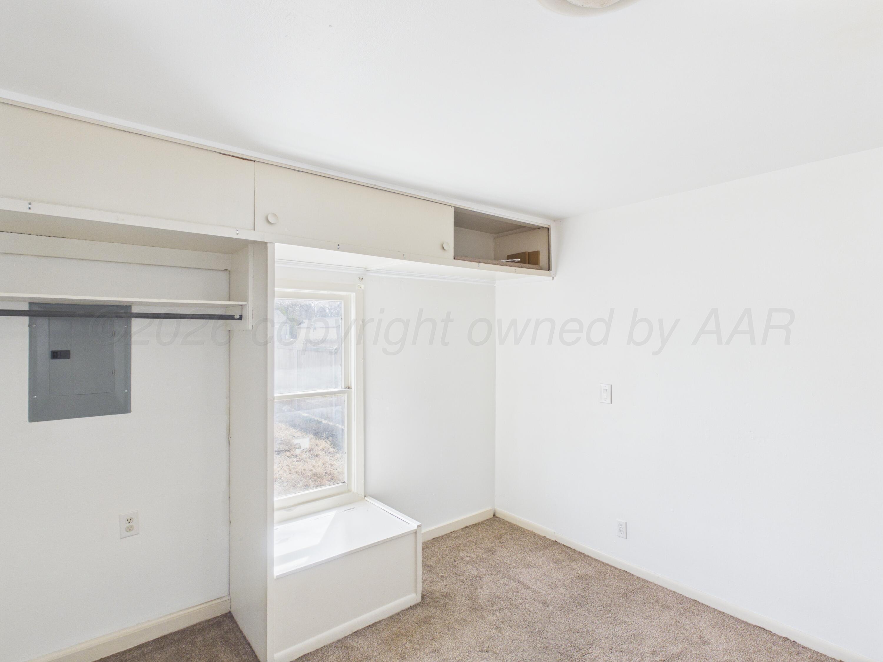 813 Northeast 3rd Street Dumas, TX 79029 - Photo 18 of 22 a view of an empty room
