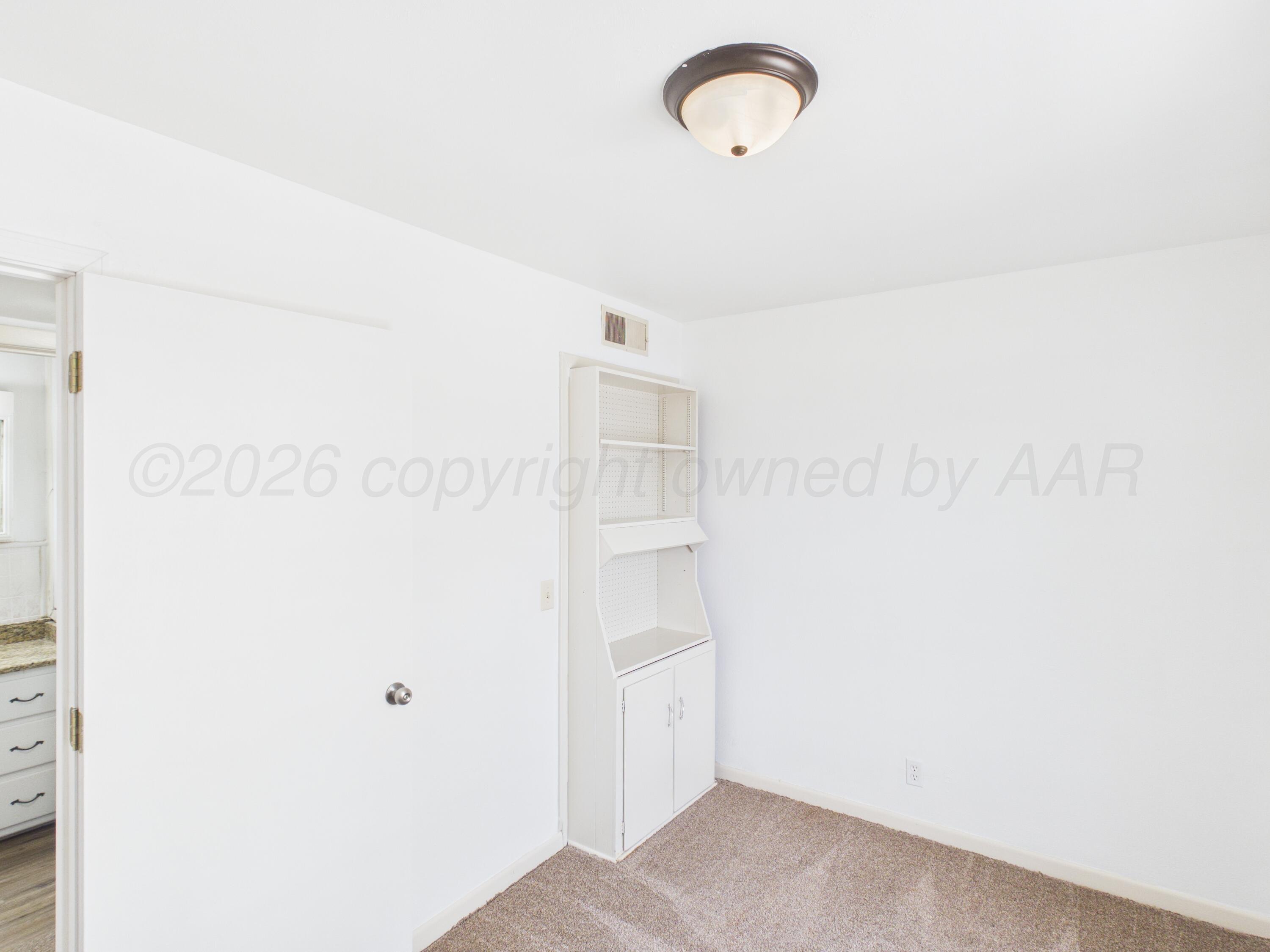 813 Northeast 3rd Street Dumas, TX 79029 - Photo 8 of 22 a picture of a room