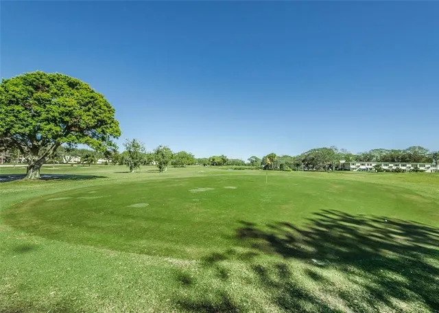a view of lake with green space