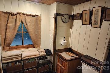 5646 Highway 18 Morganton, NC 28655 - Photo 28 of 37 a view of walk in closet with clothes and shoes