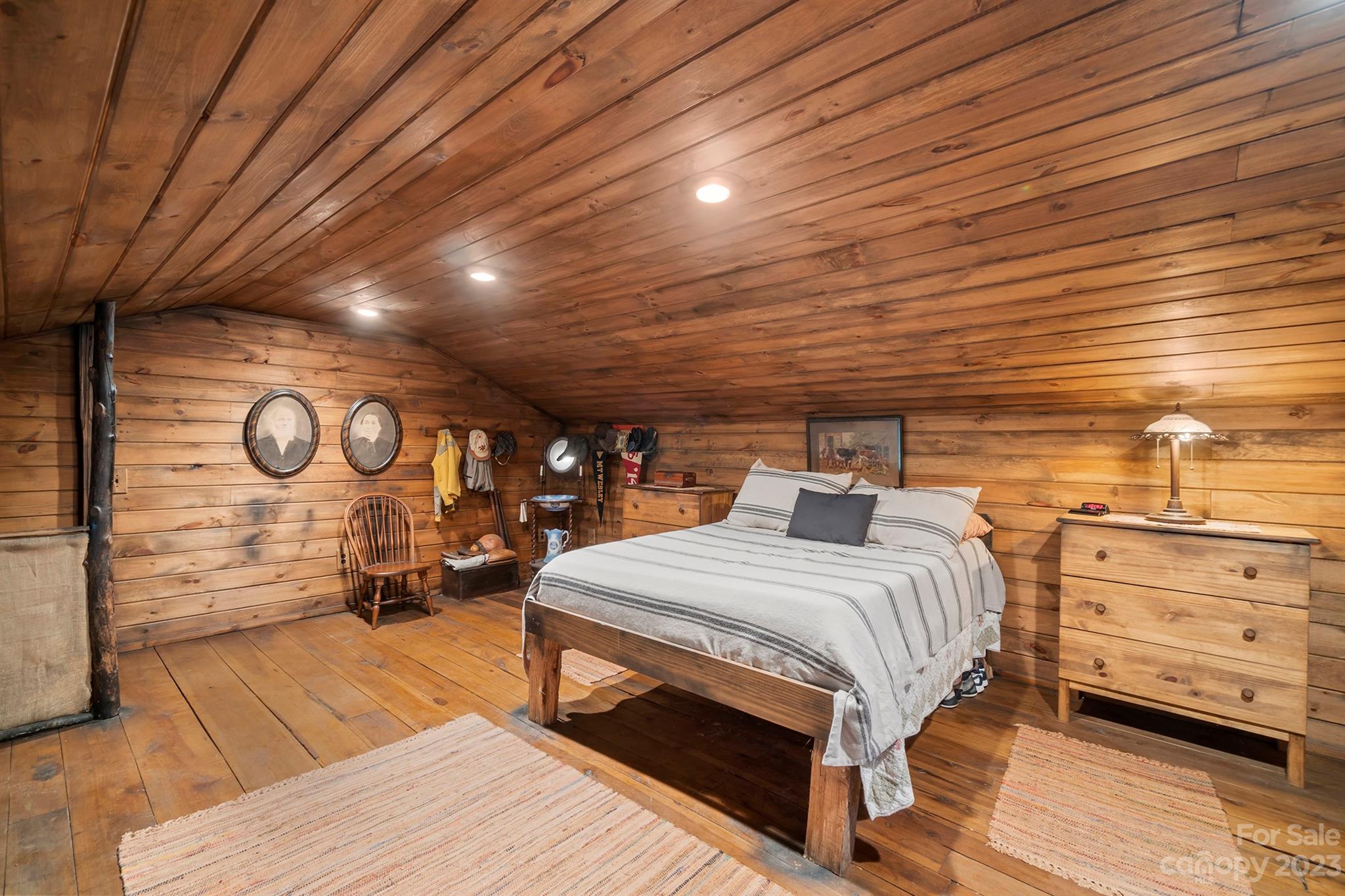 5646 Highway 18 Morganton, NC 28655 - Photo 31 of 37 a bedroom with a bed a dresser with wooden floor