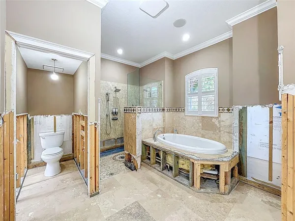 a view of a porch with wooden floor and a bench