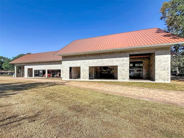 a view of a house with a yard and garage