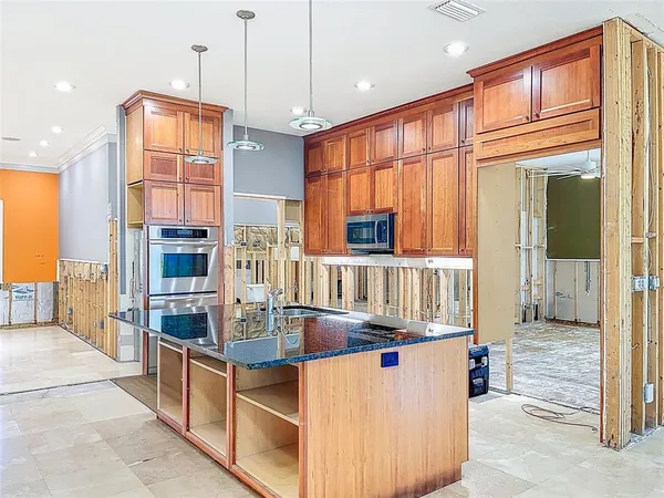 a view of a porch with wooden floor and furniture